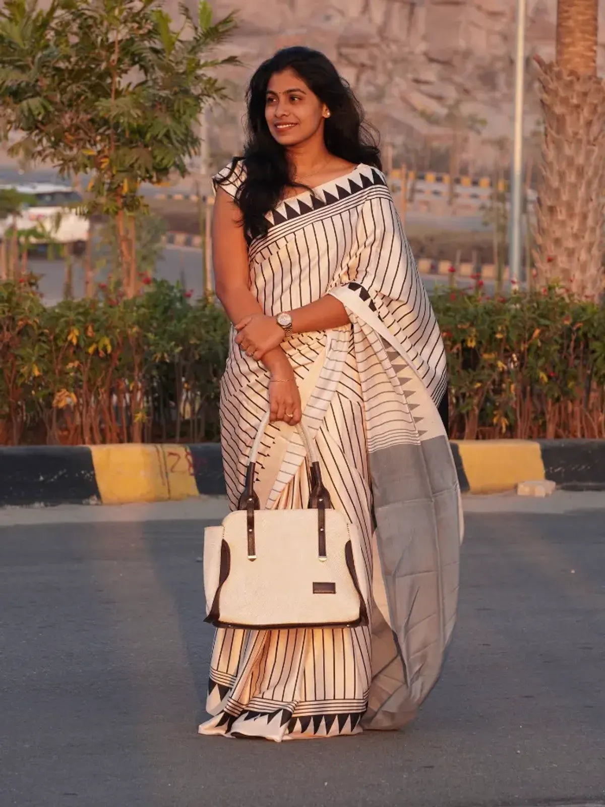"Timeless Classic Black & Ivory Striped Saree with Geometric Border"