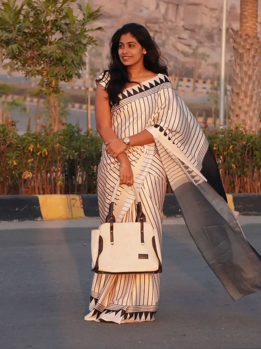 "Timeless Classic Black & Ivory Striped Saree with Geometric Border"