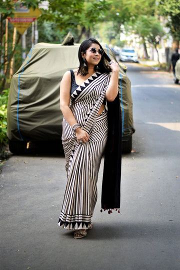 "Grace in Black and White A Timeless Saree of Stripes And Sophistication"